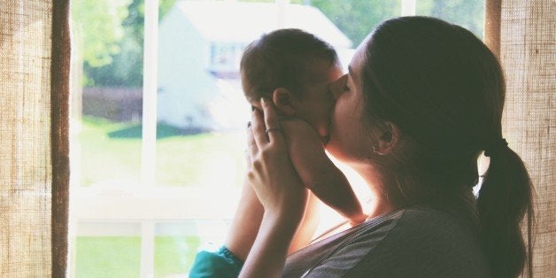 Side View Of Mother And Baby At Home