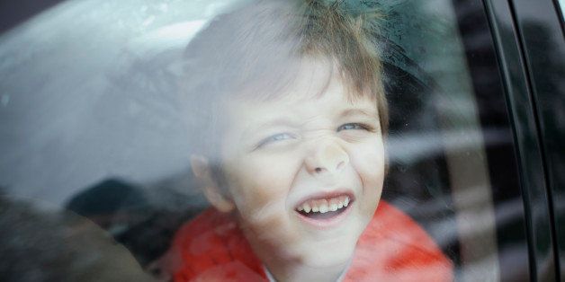 Portrait of a boy in a car