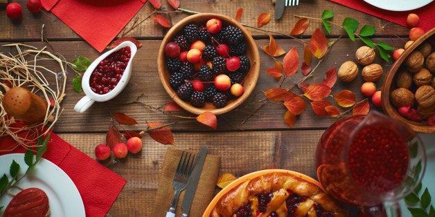 High angle view of rustic dinner table with berries