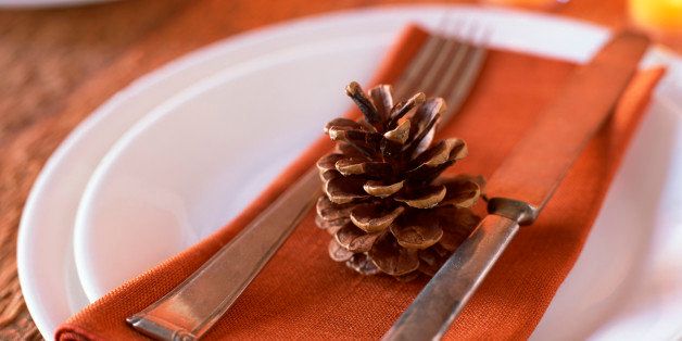 Place setting with pine cone