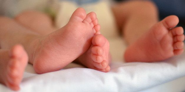 Little feet of children twins during naps