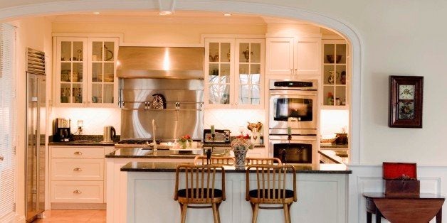 Kitchen with bar stools at counter