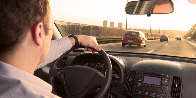 Businessman driving back home after exhausting day at work