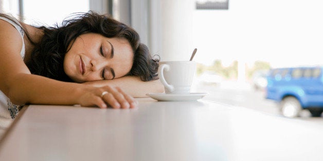 Woman sleeping in cafe