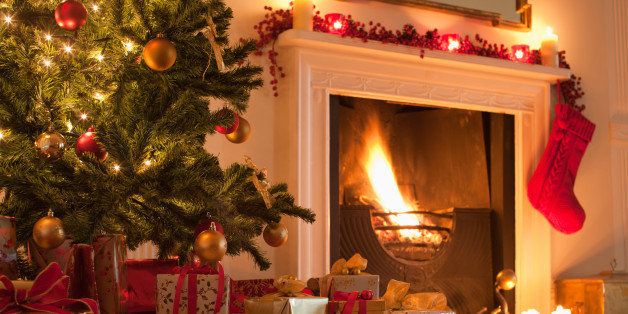 Christmas tree and stocking near fireplace