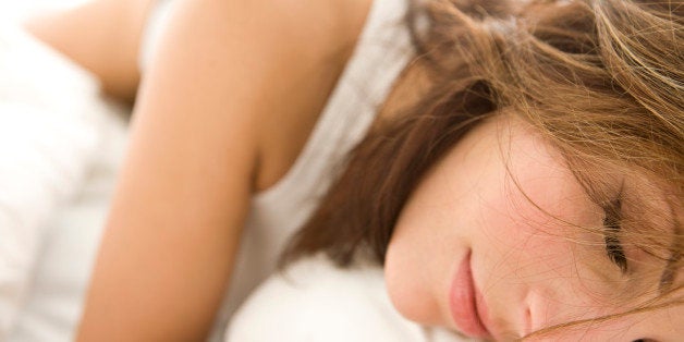 Young woman in bed, portrait