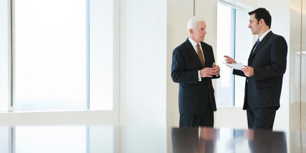 View of businesspeople discussing in an office.