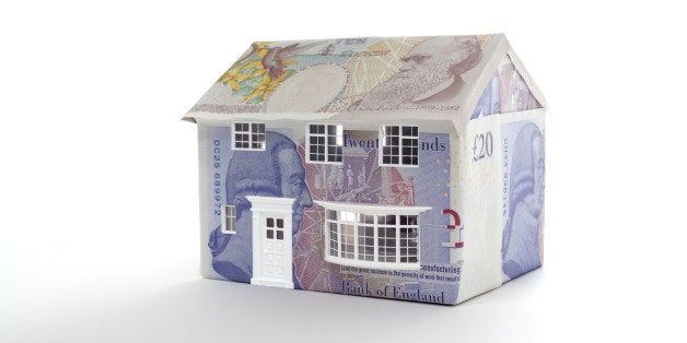 house made of british notes on white background