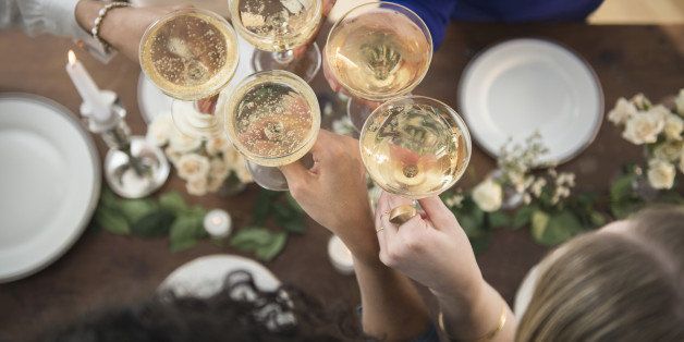 Women toasting each other with champagne