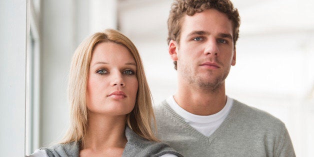 portrait of young businesswoman with male colleague