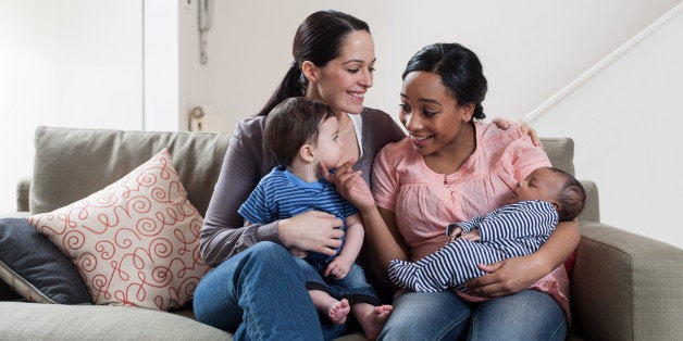 Two mothers with their babies