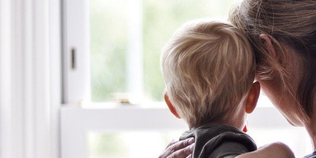 Mother and son looking out of the window