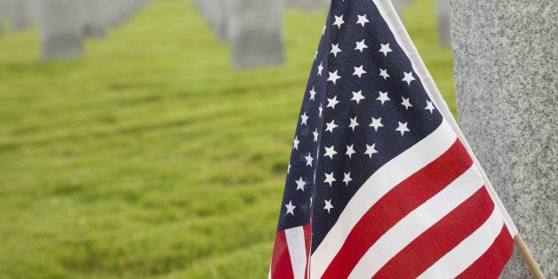 American Flag on Tombstone at a Cemetery.See more cemetery images: