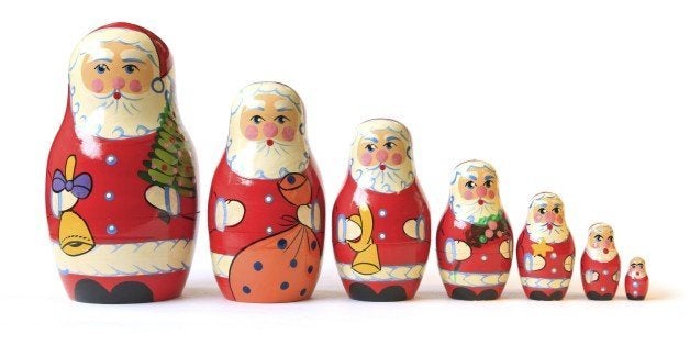 Cute old matrioshka or babushka puzzle dolls. These are Christmas Santa versions all in a row. This set of matryoshkas / babushkas consists of a wooden figure which separates to reveal a smaller figure and so on. there are many nested inside.This is a Mass Market item with the only marking being a made in china tag on the bottom.