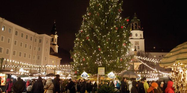 SALZBURG, AUSTRIA - NOVEMBER 28: Visitors walk among stalls at the annual Christmas market at Mozartplatz on its opening day on November 28, 2015 in Salzburg, Austria. (Photo by Johannes Simon/Getty Images)