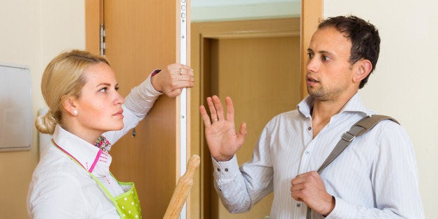 Conflict between wife and husband at the door