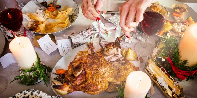 Close up of hands taking turkey and cutting food.