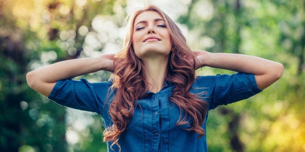 Free Happy Woman Enjoying Nature. Beauty Girl Outdoor. Freedom concept. Beauty Girl over Sky and Sun. Sunbeams. Enjoyment.