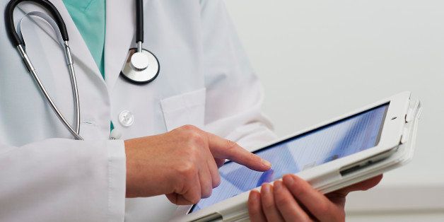 Healthcare professional using digital tablet computer