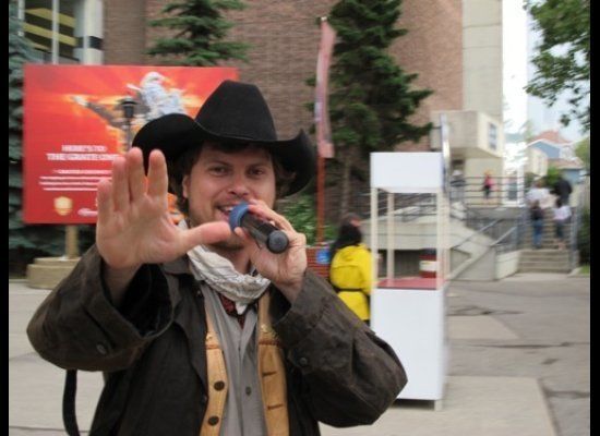A cowboy welcomes folks to the Calgary Stampede