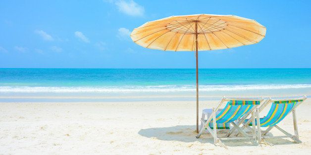 Blue sea and white sand beach with beach chairs and parasol at Samed island, Thailand - holiday and vocation concepts