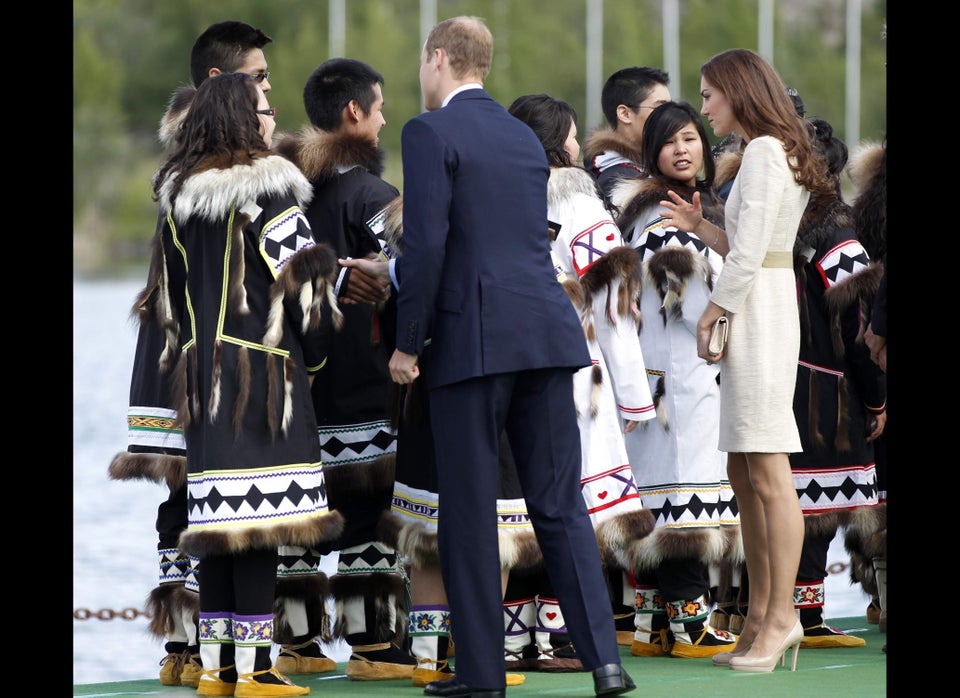 Greeting local residents dressed in traditional native clothing