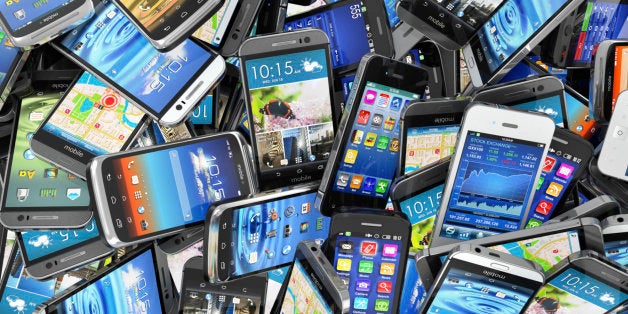 Mobile phones background. Pile of different modern smartphones. 3d