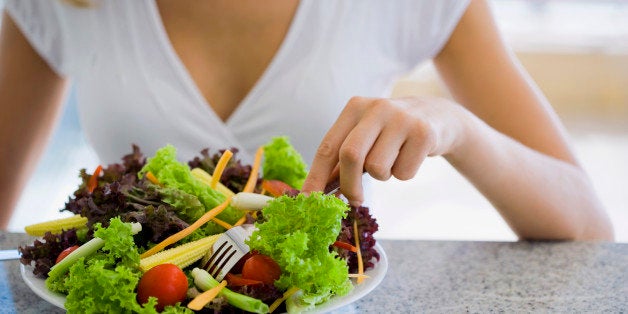 Woman eating salad