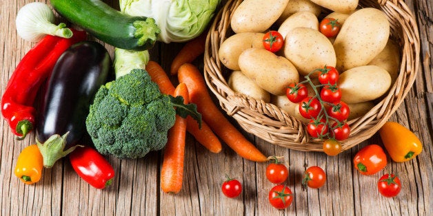 Fresh vegetable on old wooden table, top view