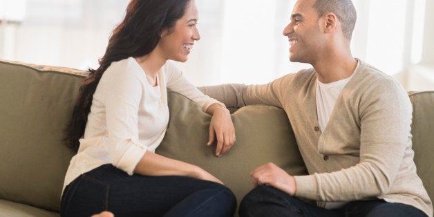 USA, New Jersey, Jersey City, Portrait of young couple sitting on couch