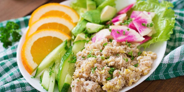 Dietary menu. Breakfast. Oatmeal porridge with vegetables (cucumber, avocado, daikon) and orange