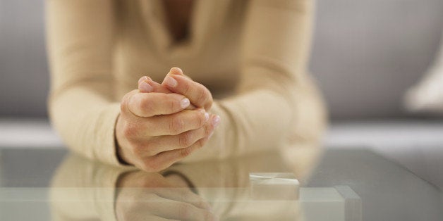 Closeup on hands of stressed young housewife