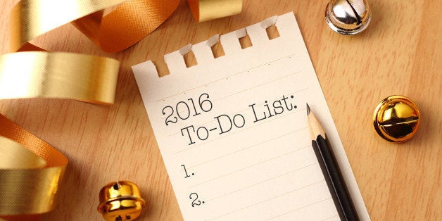 New Year's to-do list with gold color decorations. New Yearᅢ까タᅡルs goals are resolutions or promises that people make for the New Year to make their upcoming year better in some way.