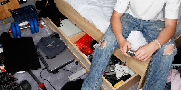 Teenage Boy in Messy Bedroom