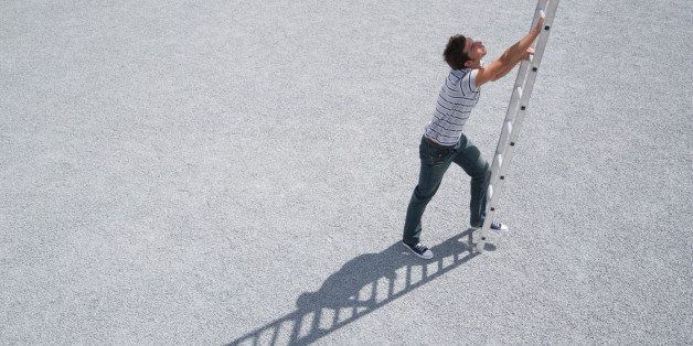Man climbing ladder outdoors