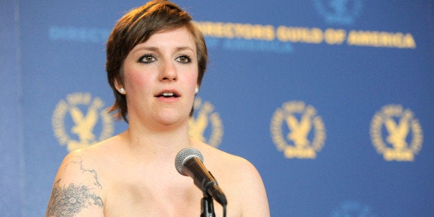 Lena Dunham poses backstage with the comedy series award for "Girls"' "Pilot" episode at the 65th Annual Directors Guild of America Awards at the Ray Dolby Ballroom on Saturday, Feb. 2, 2013, in Los Angeles. (Photo by Chris Pizzello/Invision/AP)