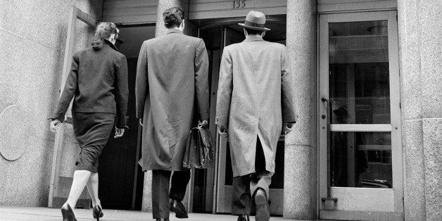 A lawyer escorting a young couple to a hearing at the Domestic Relations Court.