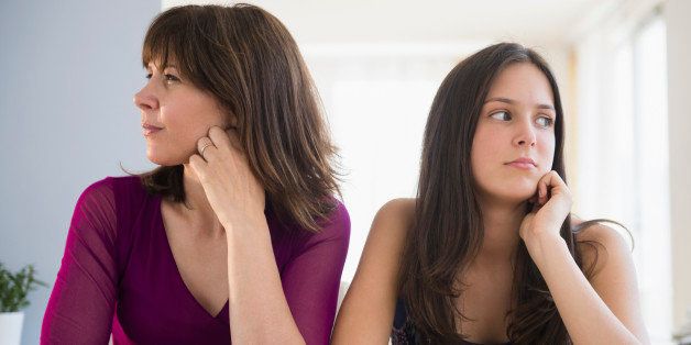 USA, New Jersey, Frustrated teenage girl (14-15) and her mom sitting at table