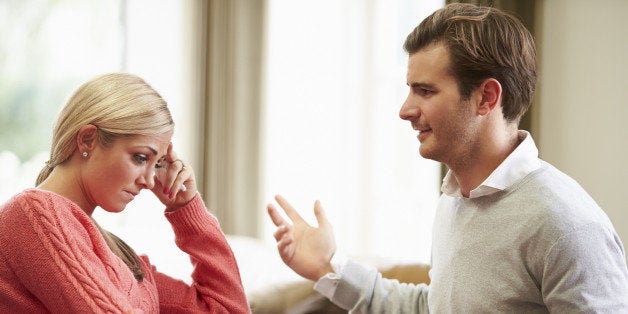 Young White British Couple Having Argument At Home