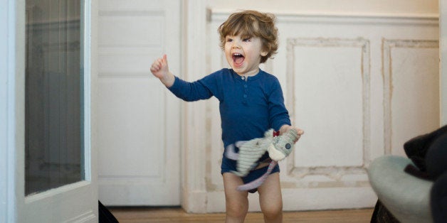 Toddler boy playing and laughing