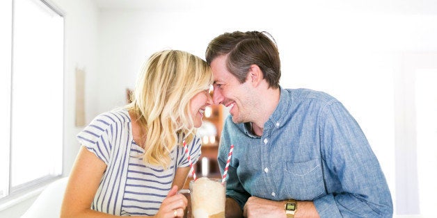 Couple spending time at home and drinking beer