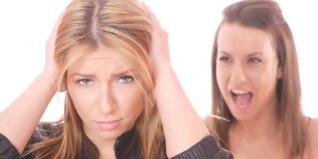 Two young woman fighting