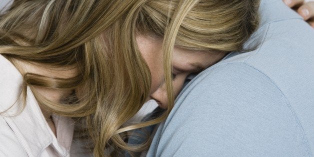 Woman being consoled