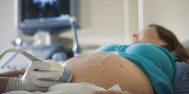 Pregnant Woman Receiving a Ultra-Sound from Her Perinatologist