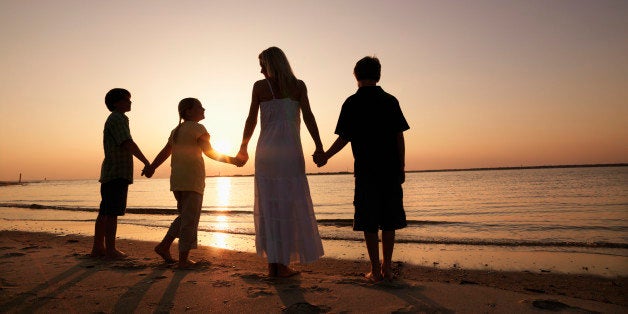 Mother with Three Children on Beach