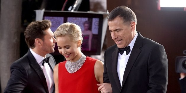 Jennifer Lawrence, left, and David O. Russell arrive at the 73rd annual Golden Globe Awards on Sunday, Jan. 10, 2016, at the Beverly Hilton Hotel in Beverly Hills, Calif. (Photo by Jordan Strauss/Invision/AP)