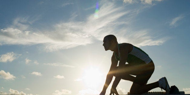 Runner in starting blocks