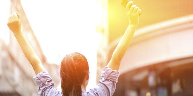 young asian woman open arms on the shopping street