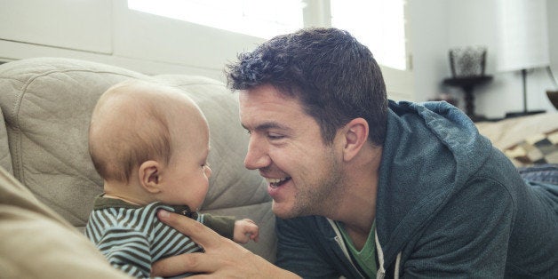 New Dad Playing with Baby