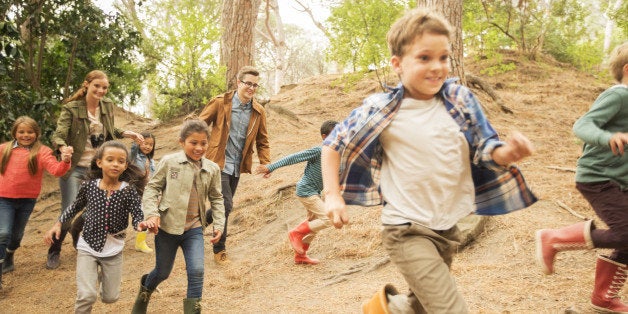 Children running in forest